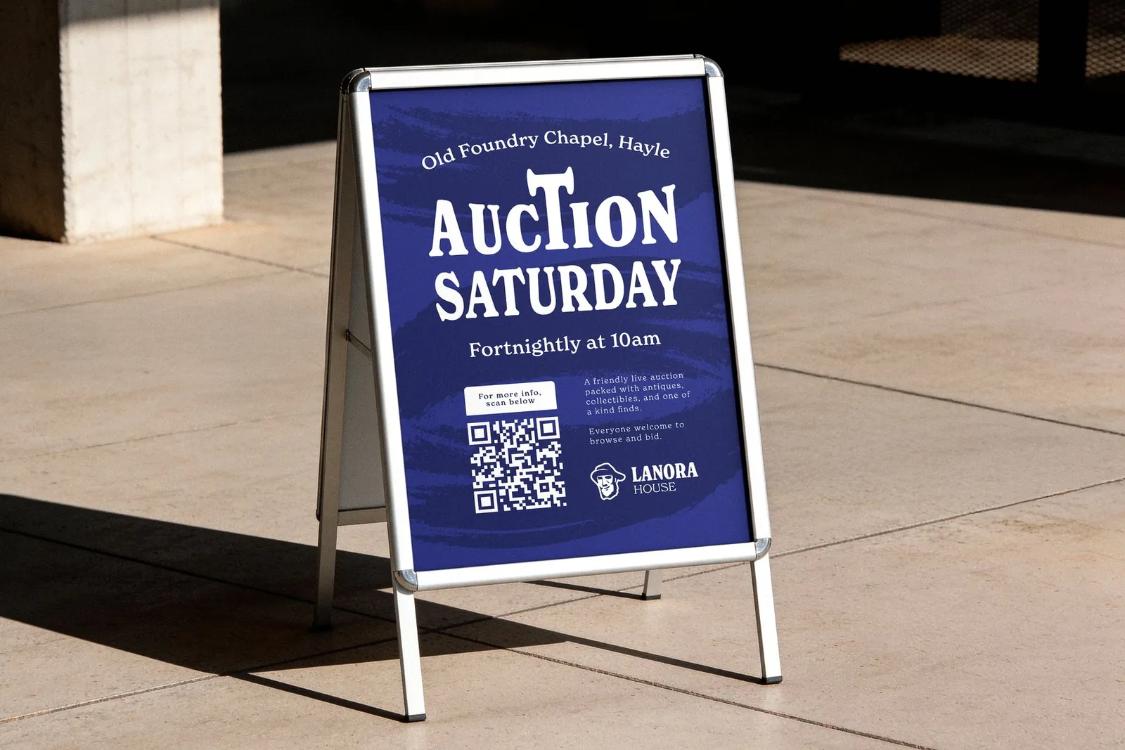 The Auction Saturday A-board outside the Old Foundry Chapel, with a QR code